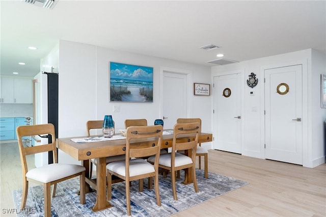 dining room featuring light hardwood / wood-style floors