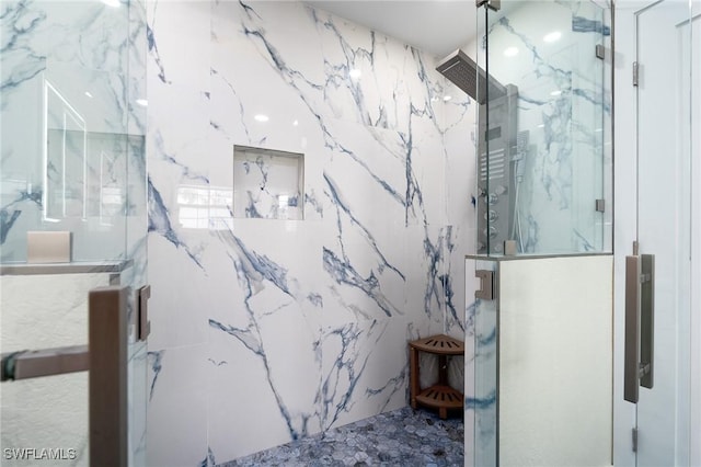 bathroom with tiled shower