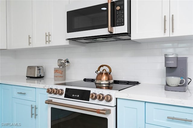 kitchen with white cabinets, white electric range, and backsplash