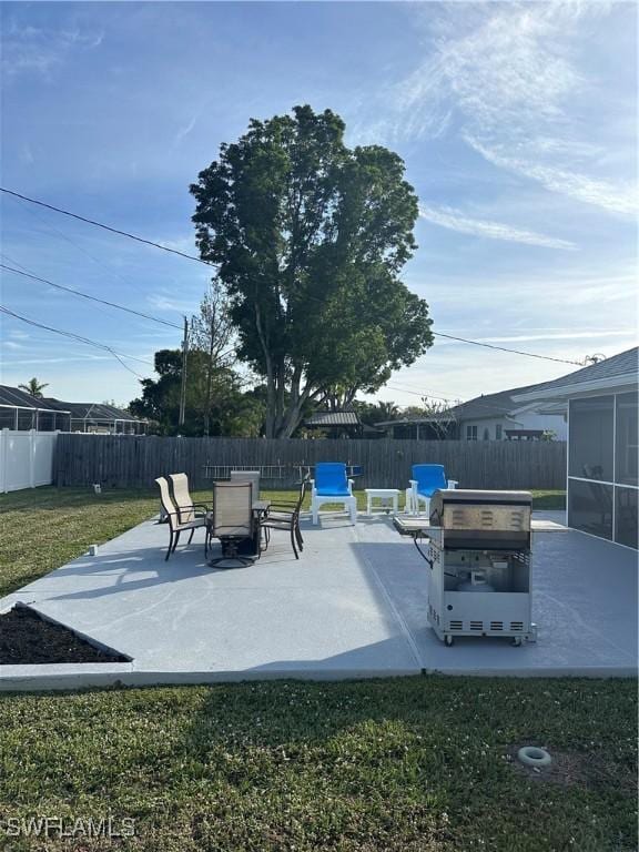 view of patio / terrace featuring a sunroom