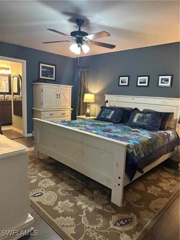 bedroom with connected bathroom and ceiling fan