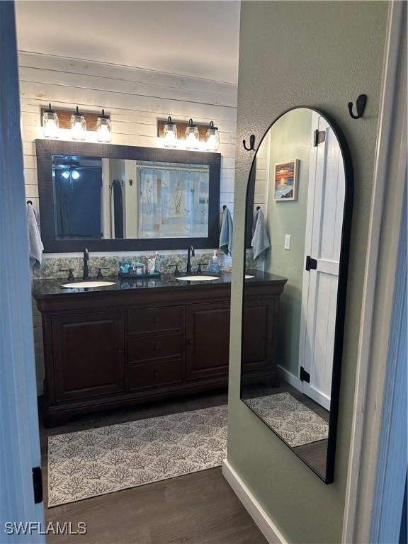 bathroom featuring vanity and wood-type flooring