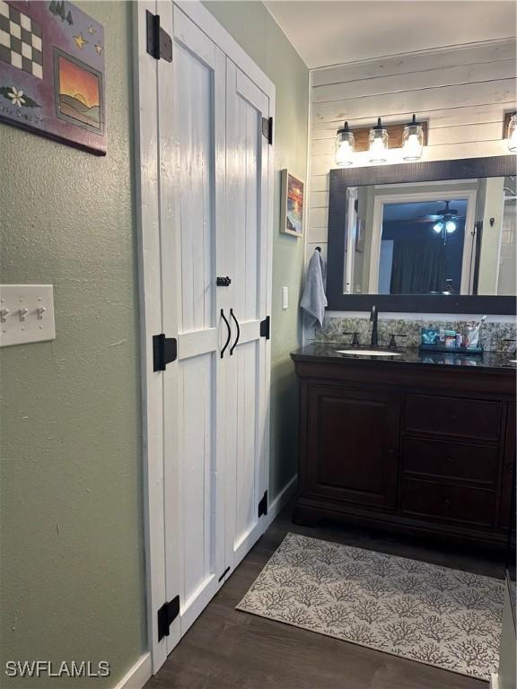 bathroom with vanity and wood-type flooring