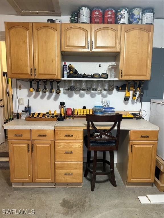 kitchen with washer / dryer and range hood