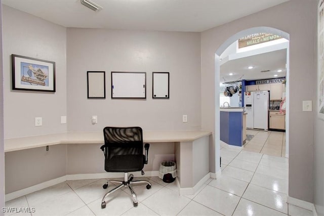 3622 NE 18th Pl, Cape Coral, FL 33909 - office space featuring light tile patterned floors, visible vents, baseboards, arched walkways, and built in study area