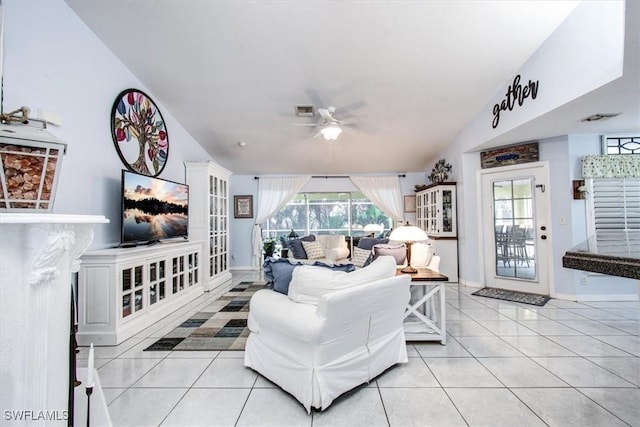 tiled living room with ceiling fan