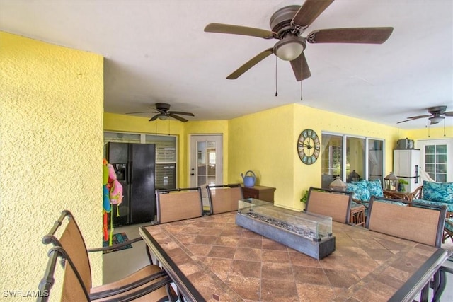3622 NE 18th Pl, Cape Coral, FL 33909 - view of patio / terrace with an outdoor living space with a fire pit, ceiling fan, and outdoor dining area