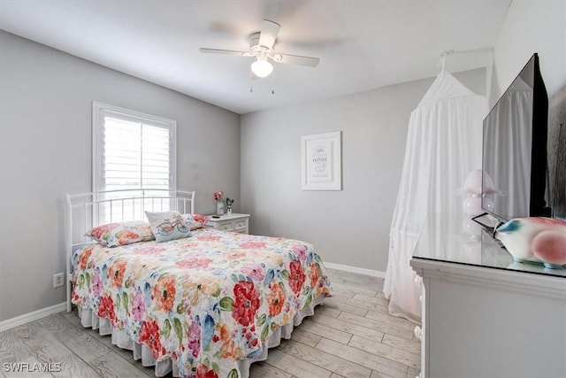 bedroom featuring ceiling fan and light hardwood / wood-style flooring