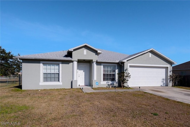 ranch-style house featuring a front yard, a garage, and stucco siding