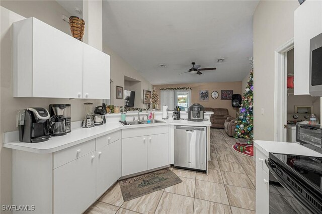 kitchen featuring kitchen peninsula, white cabinets, ceiling fan, sink, and dishwasher