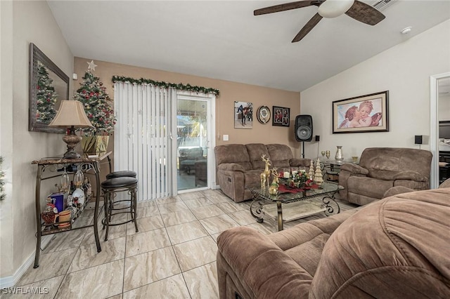 living room featuring ceiling fan and lofted ceiling