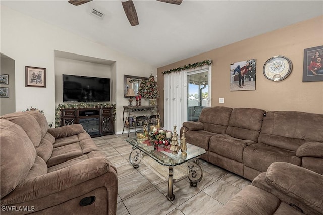 tiled living room featuring vaulted ceiling and ceiling fan