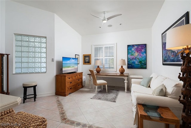 tiled living room featuring ceiling fan