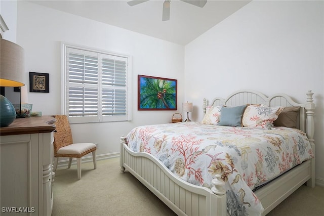 bedroom with light colored carpet, ceiling fan, and lofted ceiling