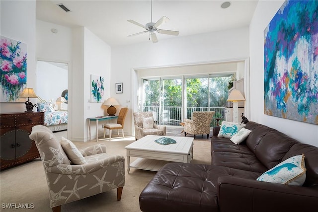 carpeted living room featuring ceiling fan