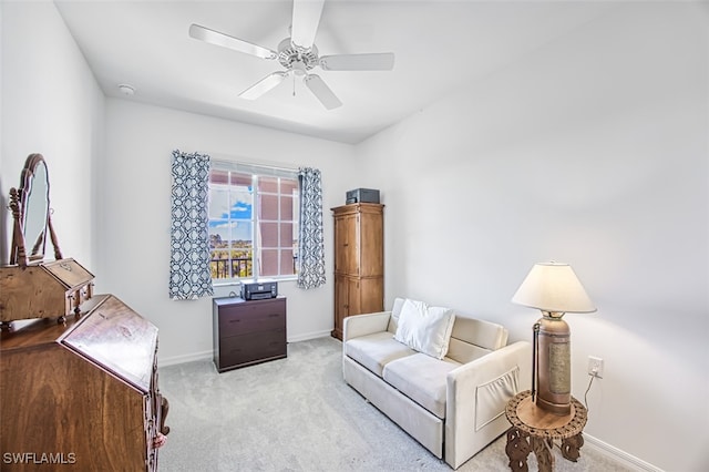 interior space with ceiling fan and light carpet