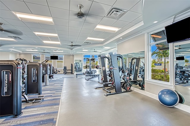 gym with a drop ceiling and ceiling fan