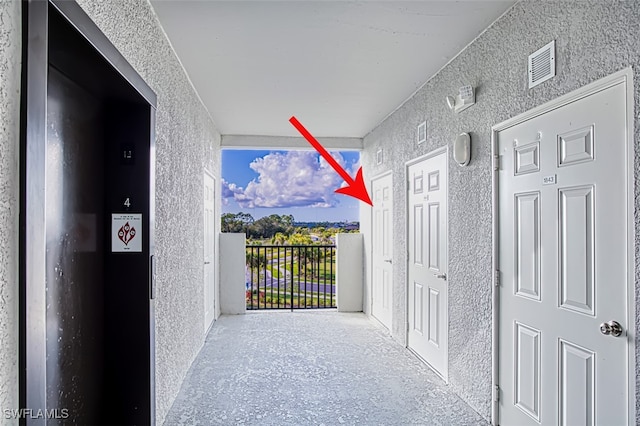 hallway with expansive windows