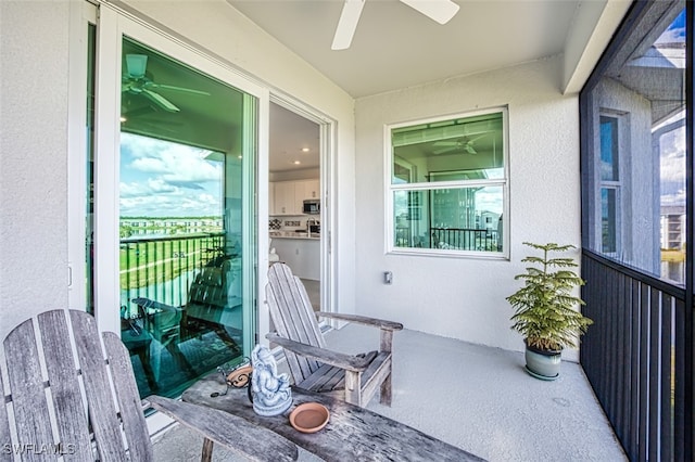 balcony featuring ceiling fan