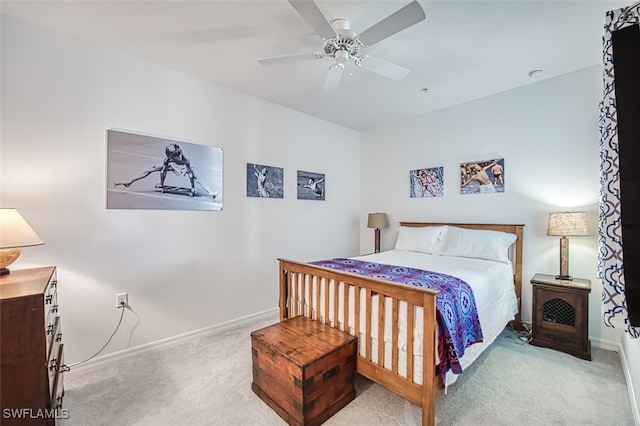 bedroom featuring ceiling fan and light colored carpet