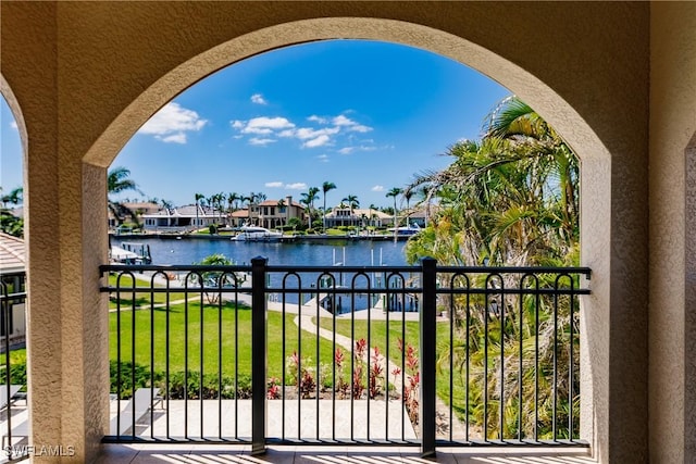 balcony featuring a water view