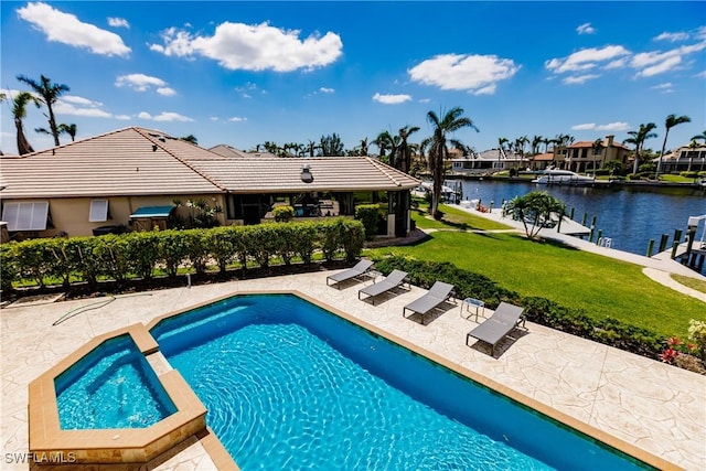 view of pool featuring a patio and a water view