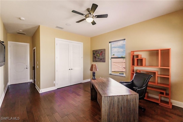 home office with ceiling fan and dark hardwood / wood-style flooring