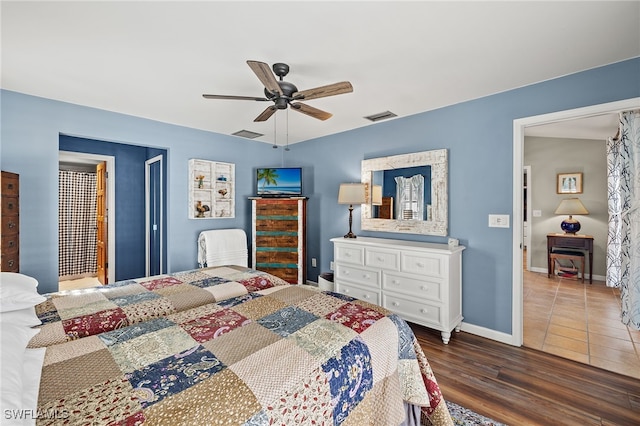 bedroom with dark wood-type flooring and ceiling fan