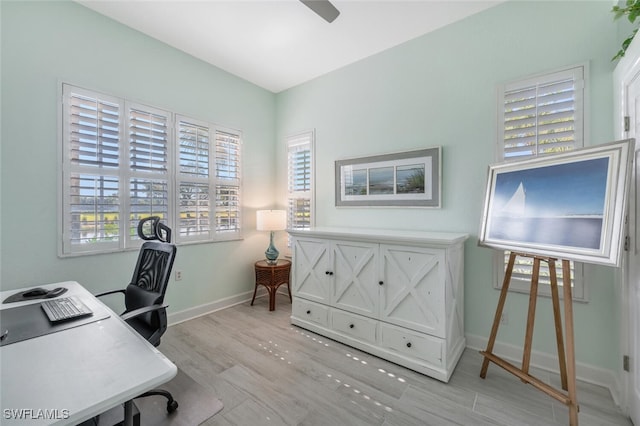 office area with light hardwood / wood-style floors