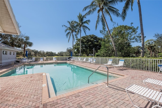 view of swimming pool featuring a patio area