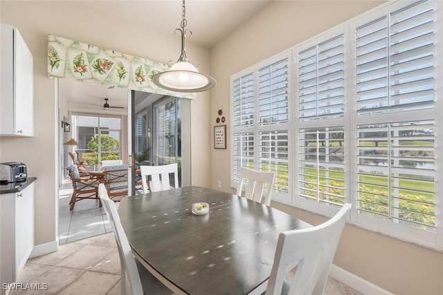 dining space featuring ceiling fan