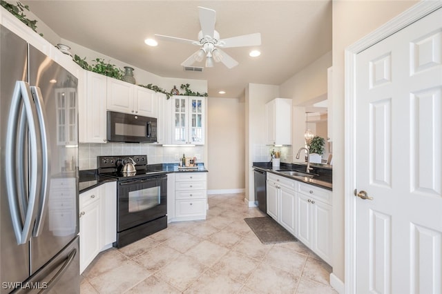 kitchen featuring white cabinets, black appliances, tasteful backsplash, sink, and ceiling fan