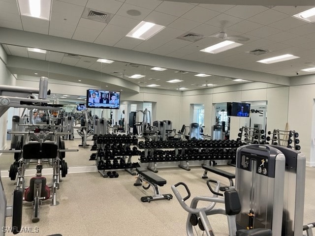 workout area with a paneled ceiling