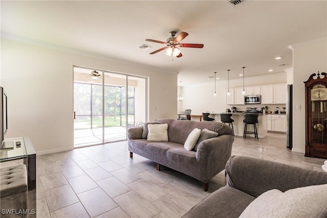 living room featuring ceiling fan and crown molding