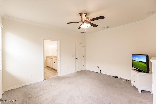 interior space with ensuite bath, ceiling fan, crown molding, and light colored carpet