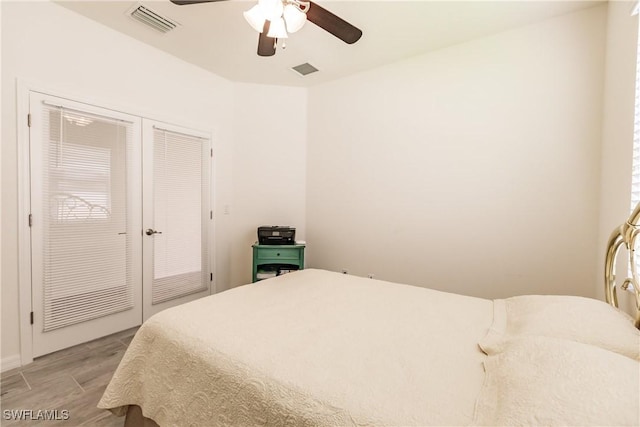 bedroom featuring ceiling fan, a closet, and light wood-type flooring