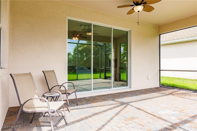 view of patio / terrace featuring ceiling fan