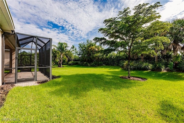 view of yard with a lanai