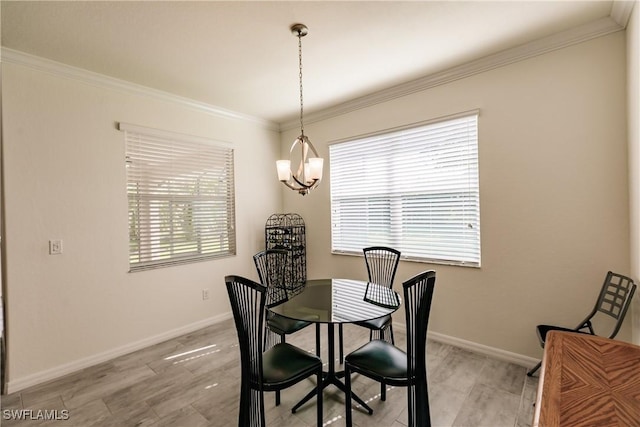 dining area featuring a notable chandelier and ornamental molding