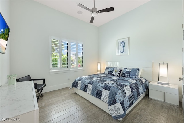 bedroom featuring hardwood / wood-style floors and ceiling fan