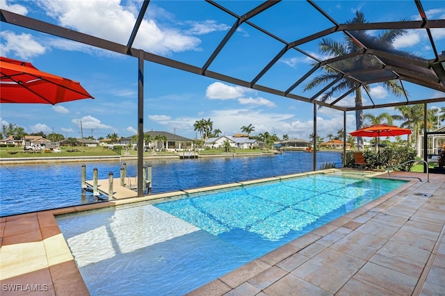 view of swimming pool with a water view, a boat dock, glass enclosure, and a patio area