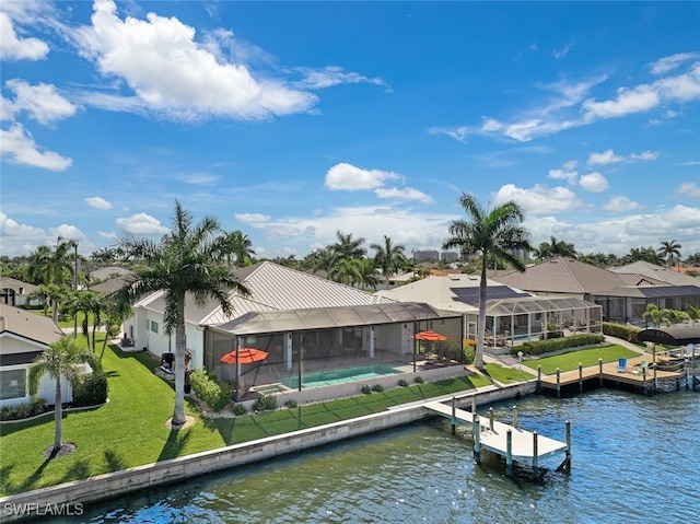 view of dock featuring a water view, glass enclosure, and a lawn