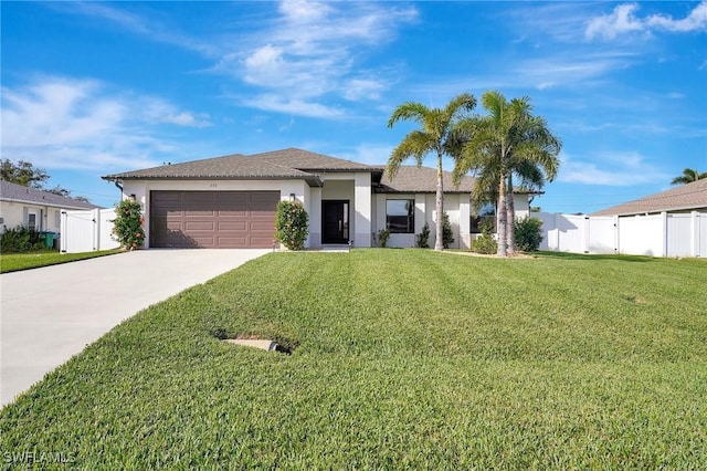 view of front of property featuring a front yard and a garage