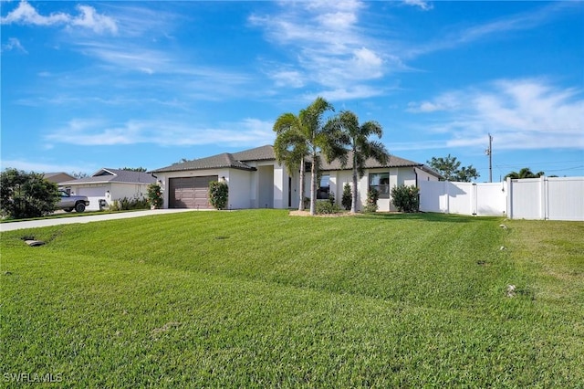 ranch-style home with a front lawn and a garage