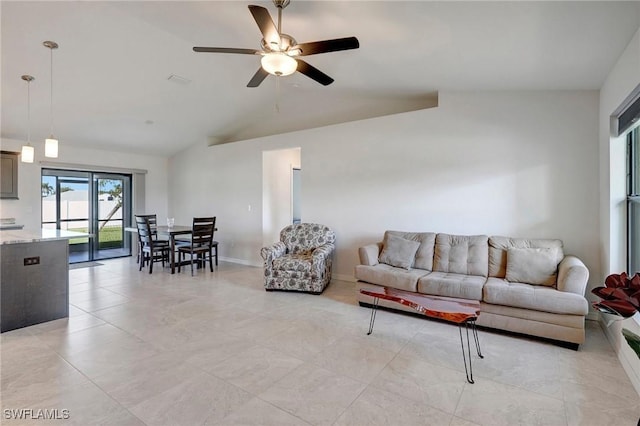 living room with ceiling fan and vaulted ceiling