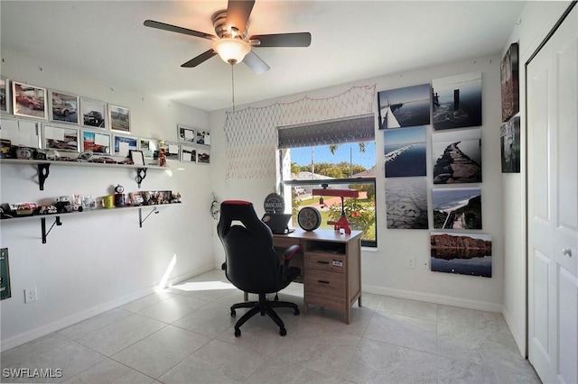 tiled office featuring ceiling fan