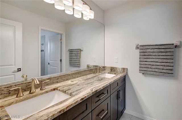 bathroom with tile patterned floors and vanity