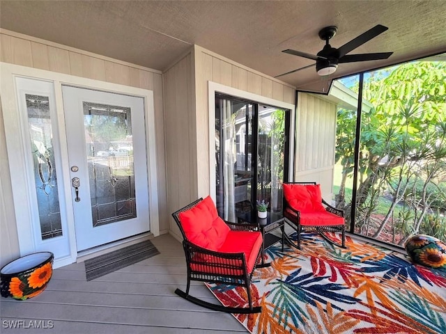 exterior space with ceiling fan