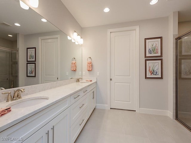 bathroom with tile patterned flooring, vanity, and an enclosed shower