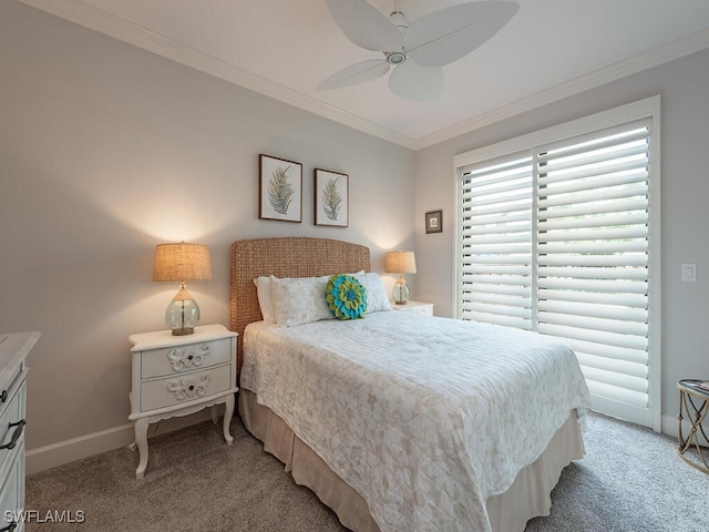 carpeted bedroom featuring ceiling fan and crown molding